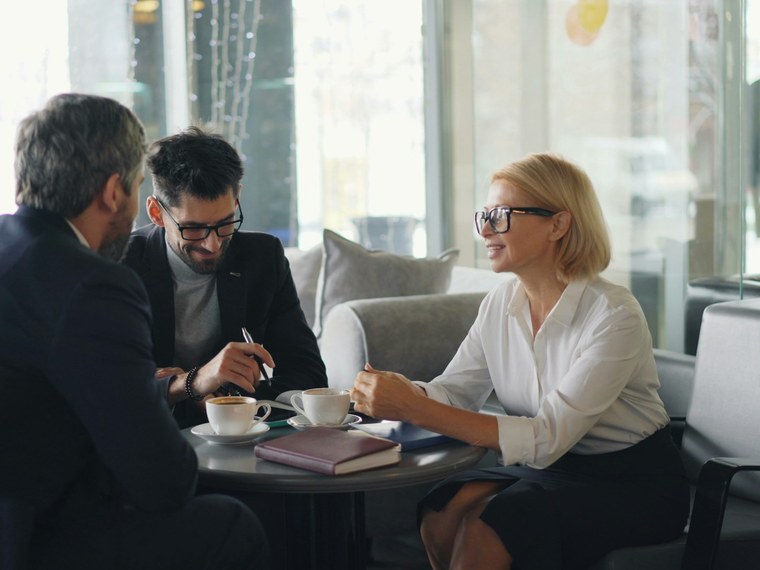 A retirement-planning consultation between an advisor and clients